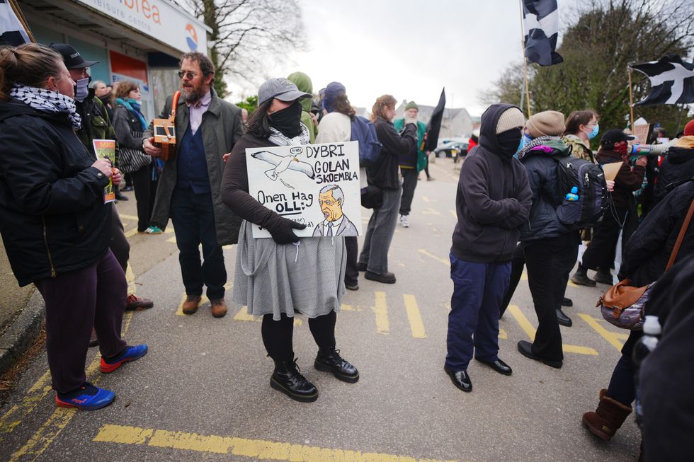 Protesters outside the Reform UK Cornwall conference at Carn Brea Leisure Centre, Redruth