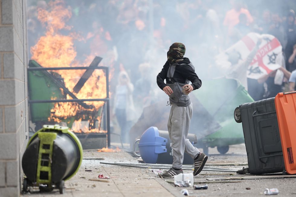 Protestors during riots outside a Holiday Inn in Manvers