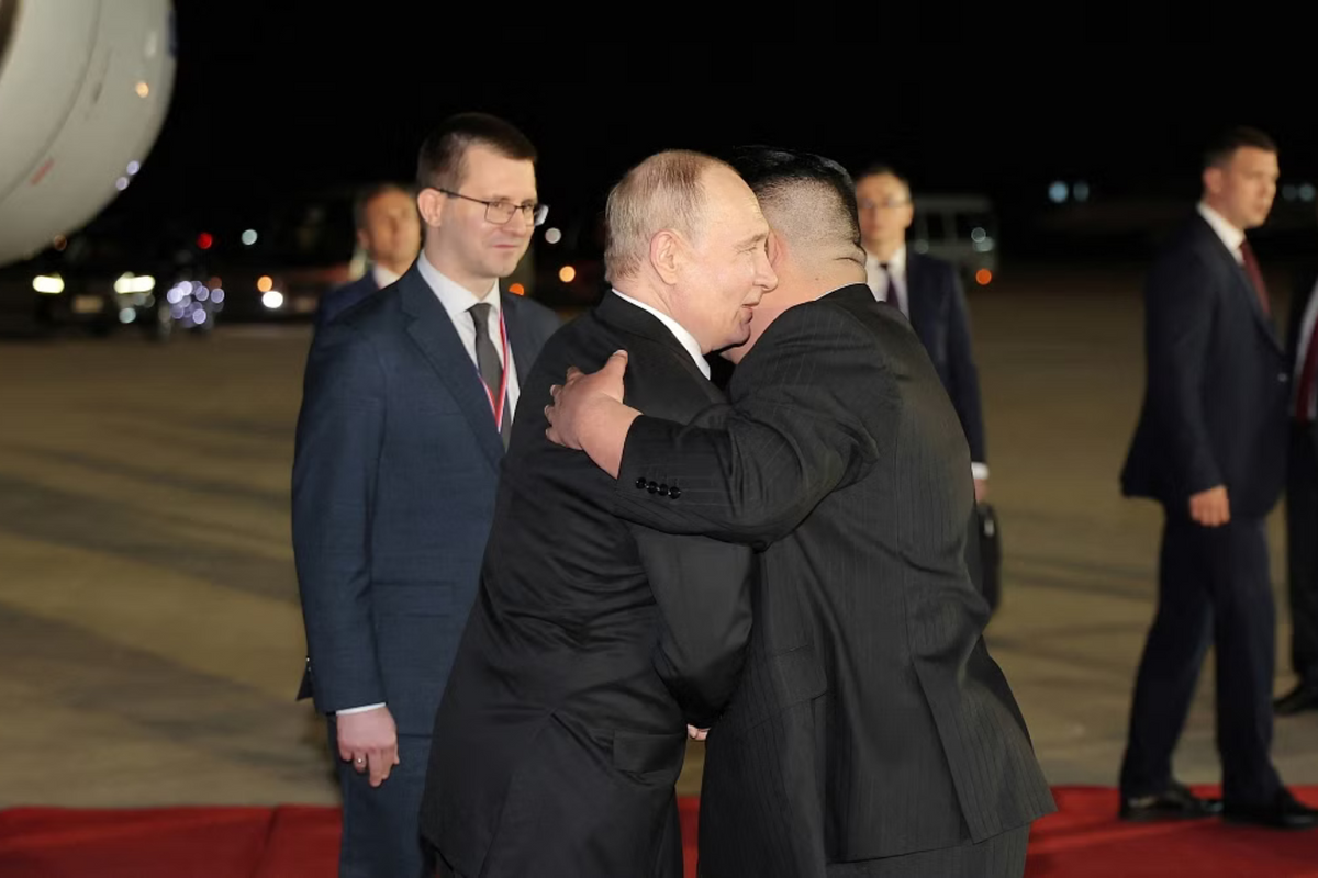 Putin and Kim Jong-un hugging