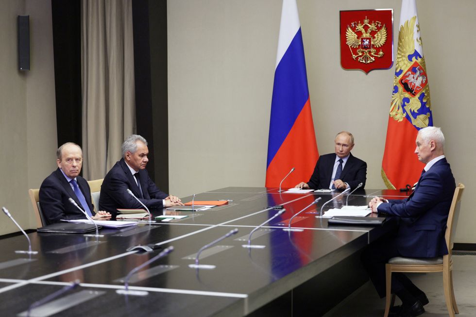 Putin and officials in security briefing