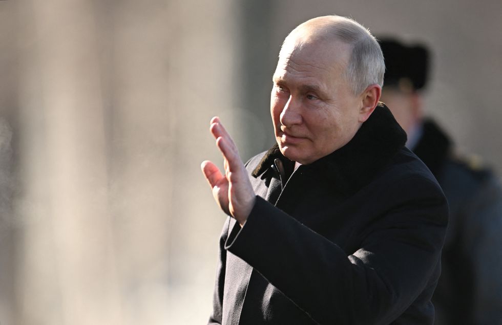 Putin waving