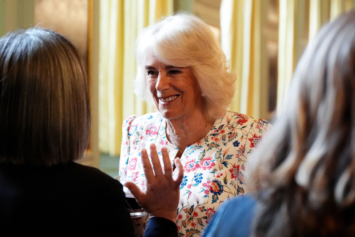 Queen Camilla smiles as she hosts a celebration for those who work to promote Scottish Literacy