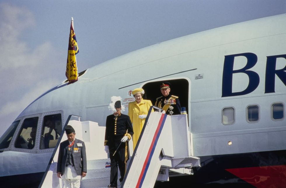 Queen Elizabeth II and Prince Philip, Duke of Edinburgh leaving their British Airways flight at the start of their five-day State Visit in Kathmandu, Nepal, 1986.