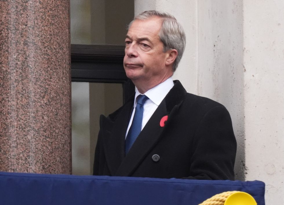 Reform UK leader Nigel Farage on a balcony at the Foreign, Commonwealth and Development Office (FCDO) ahead of the Remembrance Sunday service at the Cenotaph in London