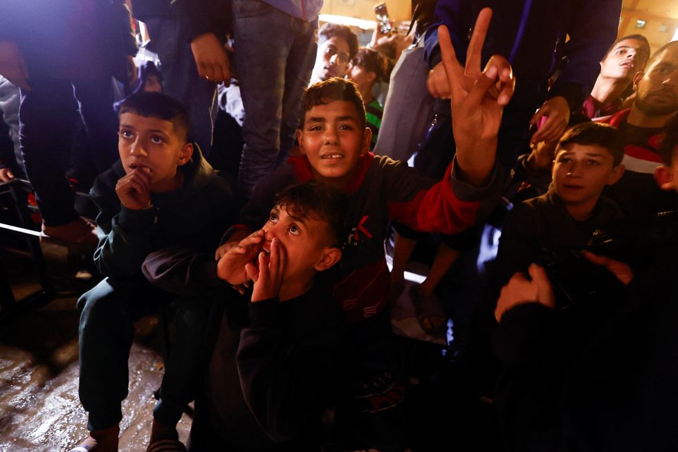 Residents in Gaza celebrate after news