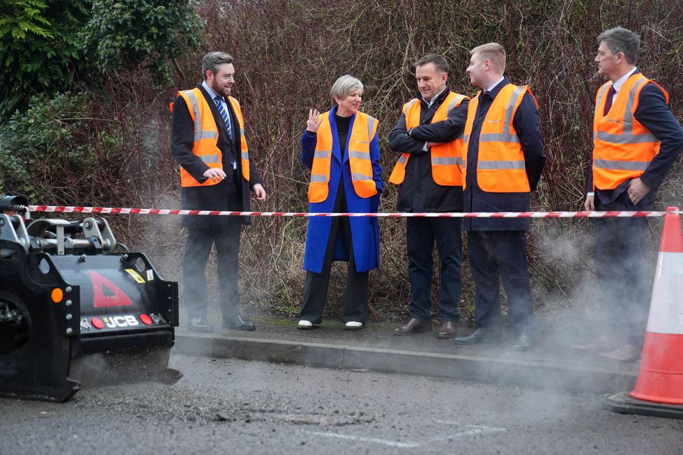 Roads Minister Lilian Greenwood filling in potholes