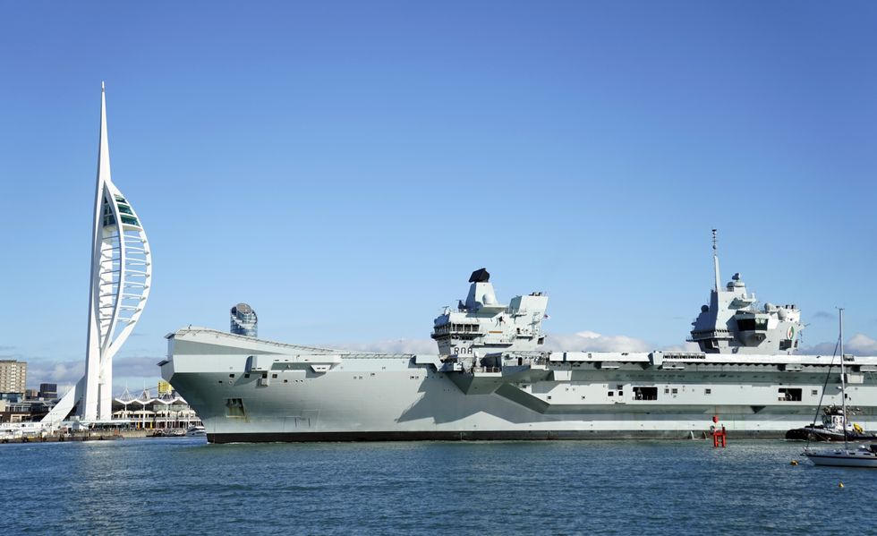 Royal Navy Aircraft carrier HMS Queen Elizabeth arrives back into Portsmouth harbour after a visit to the United States