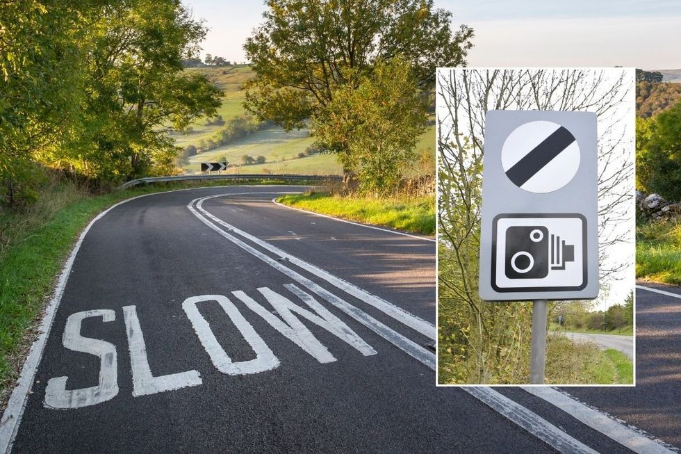 Rural road and a national speed limit sign