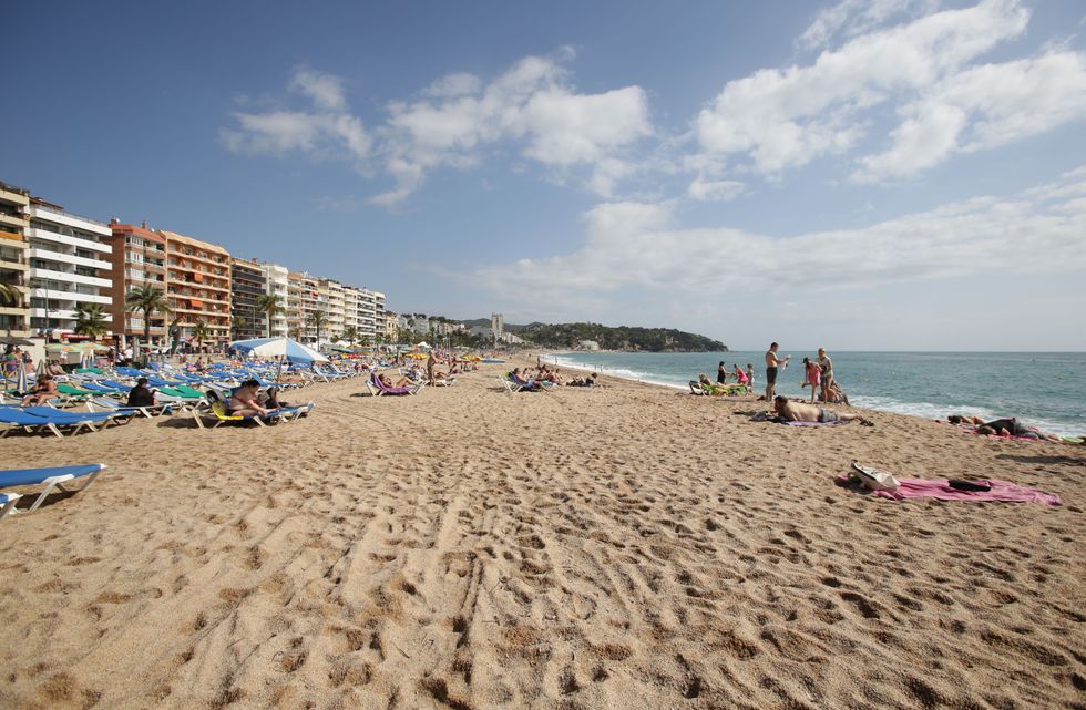 Sandy beach with sunny skies in Spain