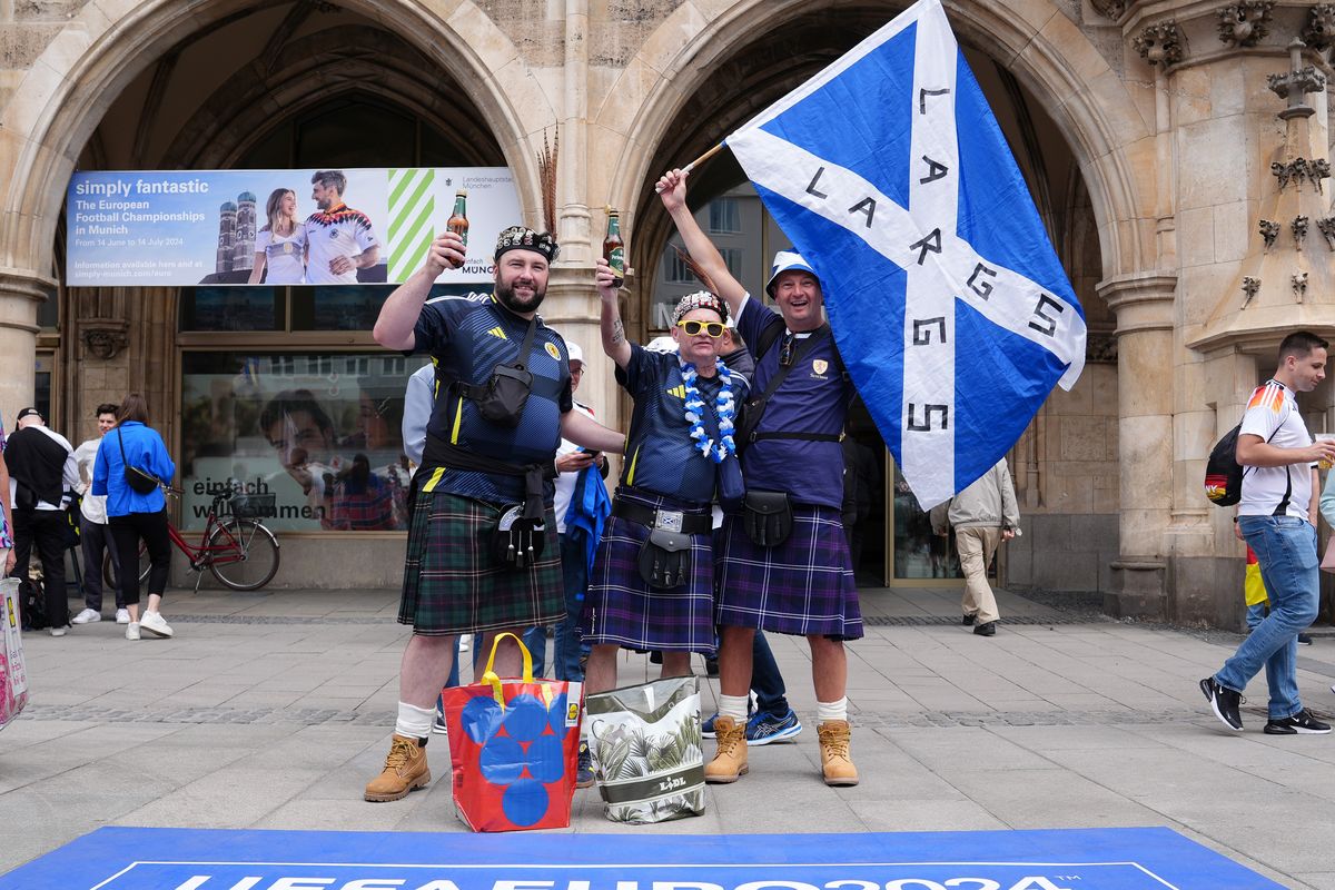 Scotland fans pose for a photo at Marienplatz square, Munich