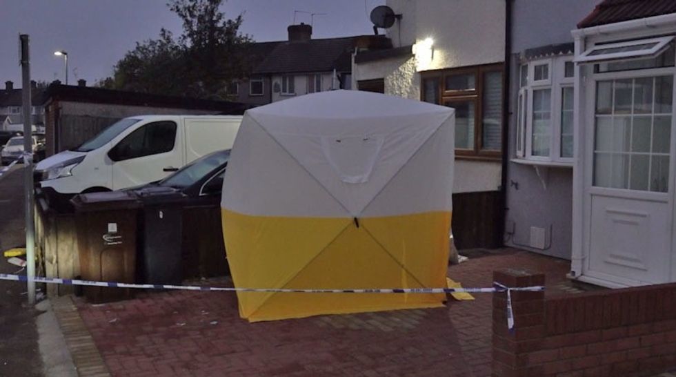 Screengrab taken from PA Video of a police tent at a property on First Avenue in Dagenham