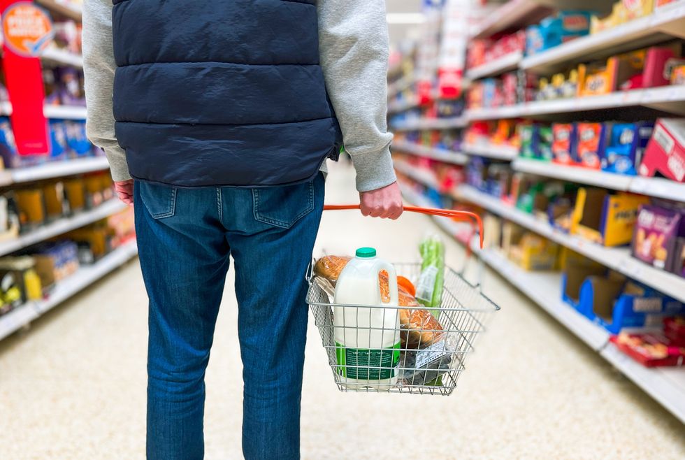 Shopper holding basket