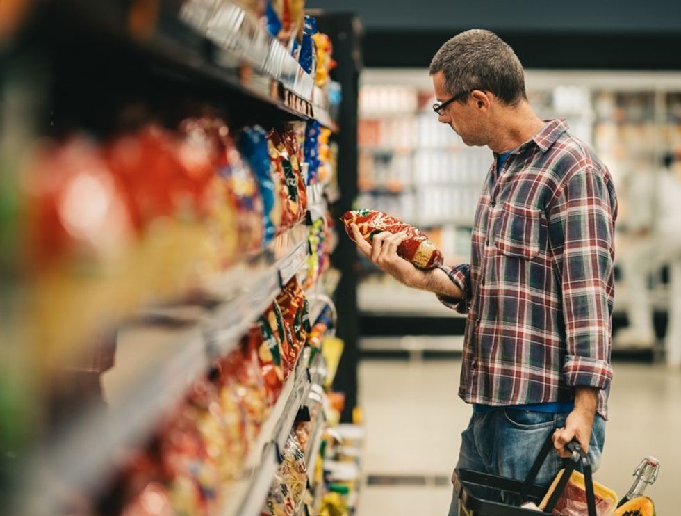 shopper holding crisps