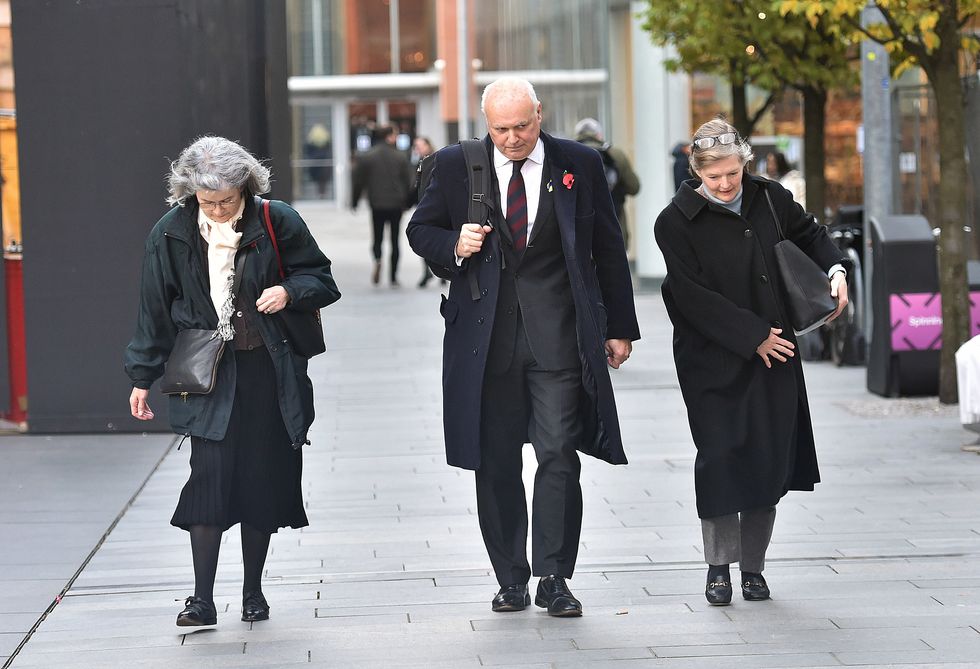 Sir Iain Duncan Smith leaving Manchester Magistrates Court with his wife Betsy and Primrose Yorke (left) after giving evidence in the trial of Elliot Bovill, who denies common assault, and Radical Haslam who along with Ruth Wood, both deny using threatening, abusive or insulting words or behaviour with intent to cause harassment, alarm or distress. The former Tory leader told the court how he feared for his wife and her friend when he had a traffic cone "slammed" on to his head as they were followed by a "threatening" group of protesters hurling abuse at him. Picture date: Monday November 14, 2022.