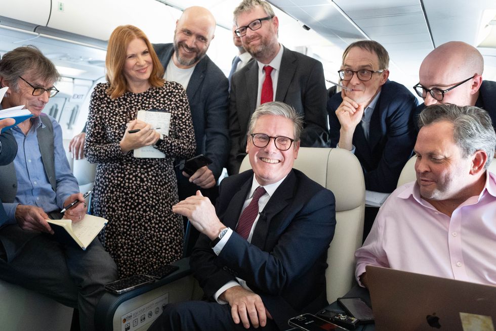 Sir Keir Starmer with journalists, including Katherine Forster, on his journey to Washington DC earlier this year