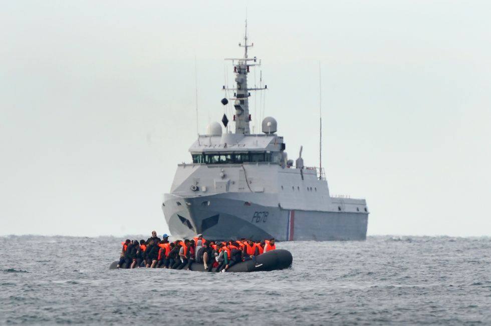 Small boat and French navy vessel