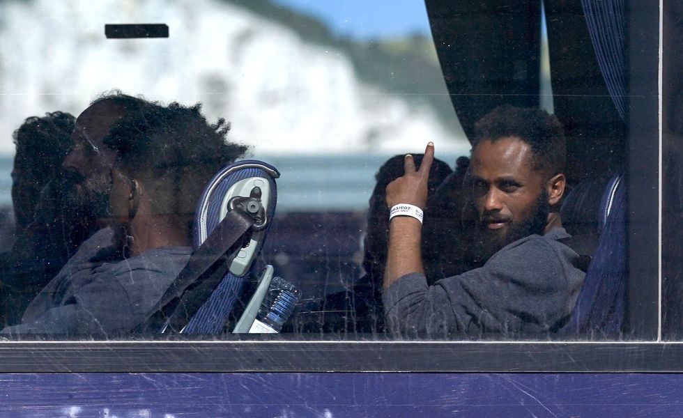 Small boats migrants on coach in the UK