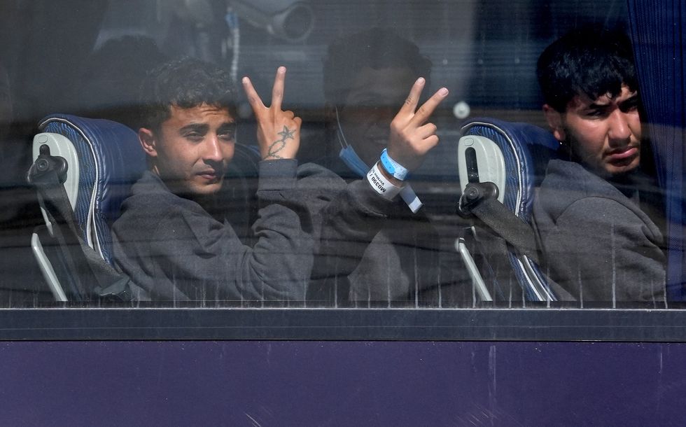 Small boats migrants on coach in the UK