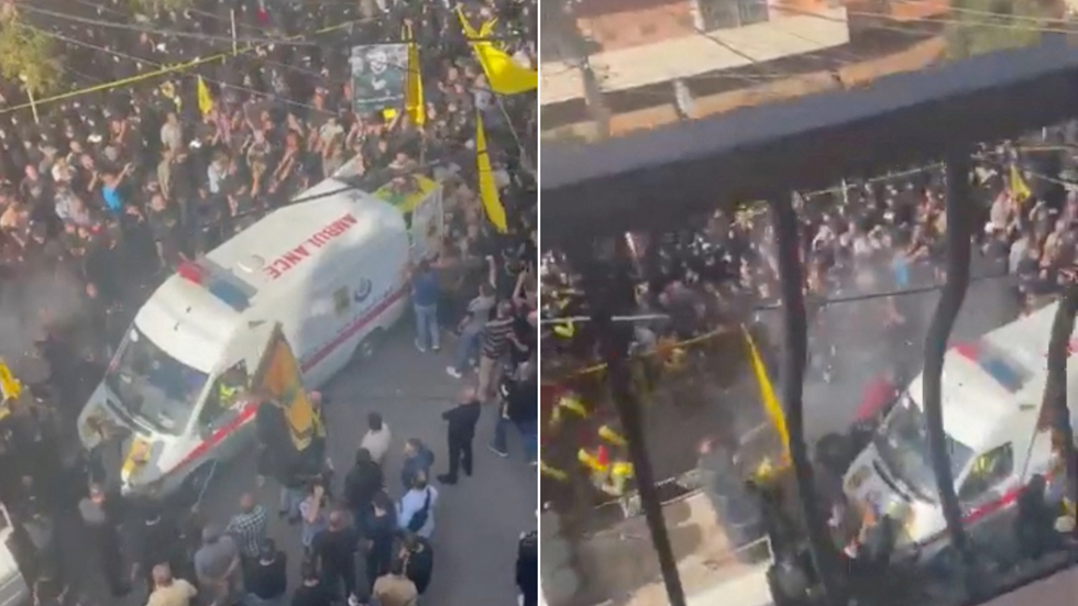 Smoke rises from an explosion during a funeral, coinciding with a second day of devices used by Hezbollah members detonating