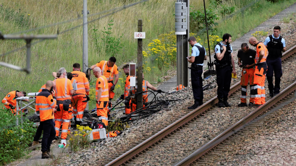 SNCF workers and police by a train line