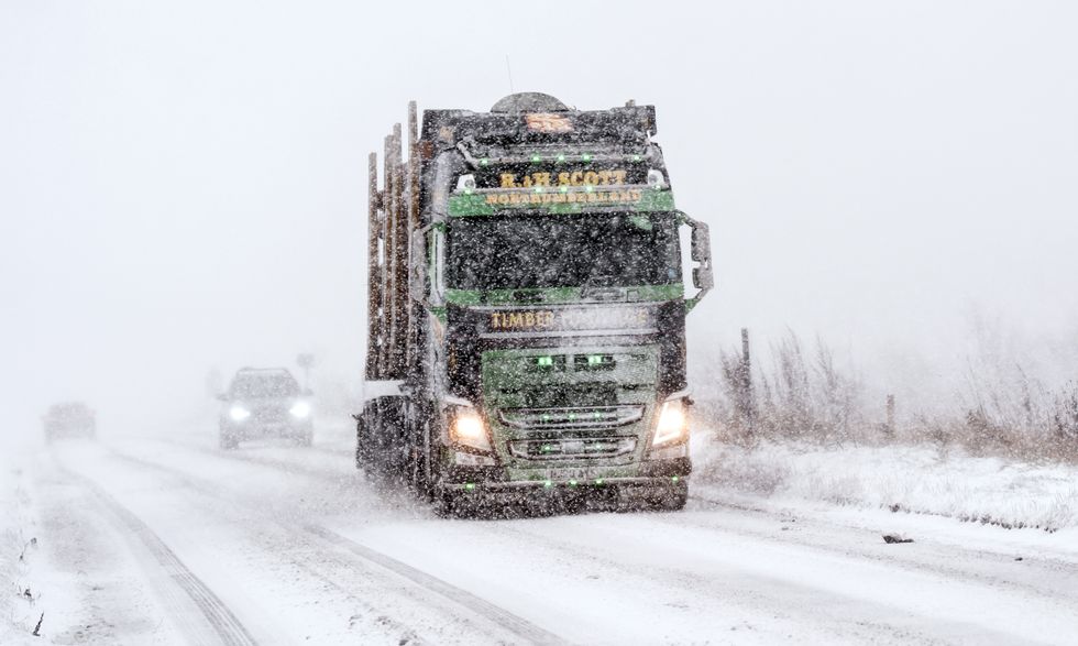 Snow-covered road with lorry