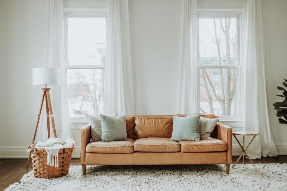 Sofa in living room by windows