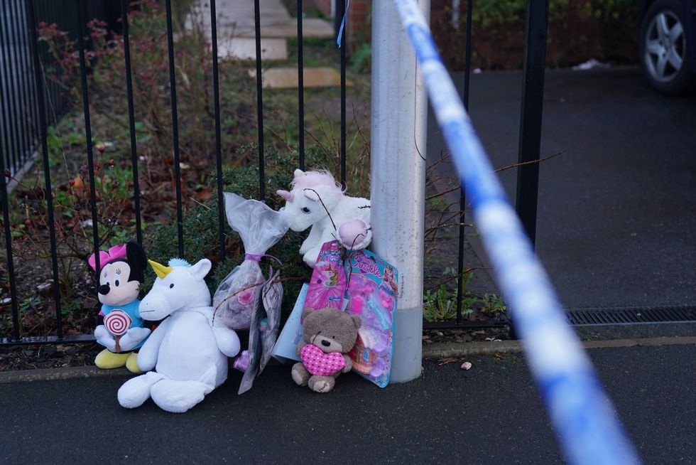 Soft toys and flowers left at the scene