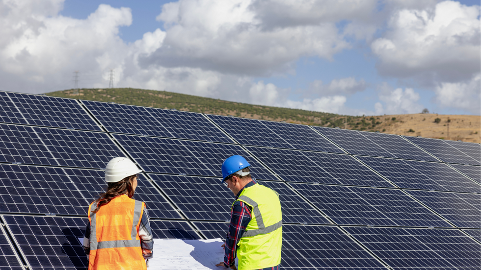 Solar panels and workers