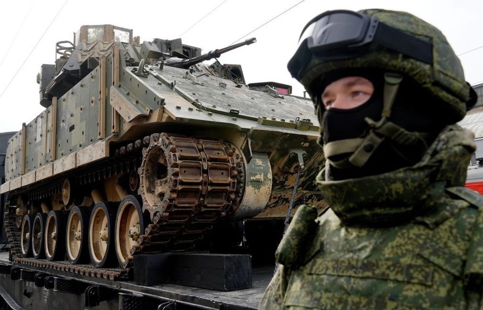 Soldier next to tank