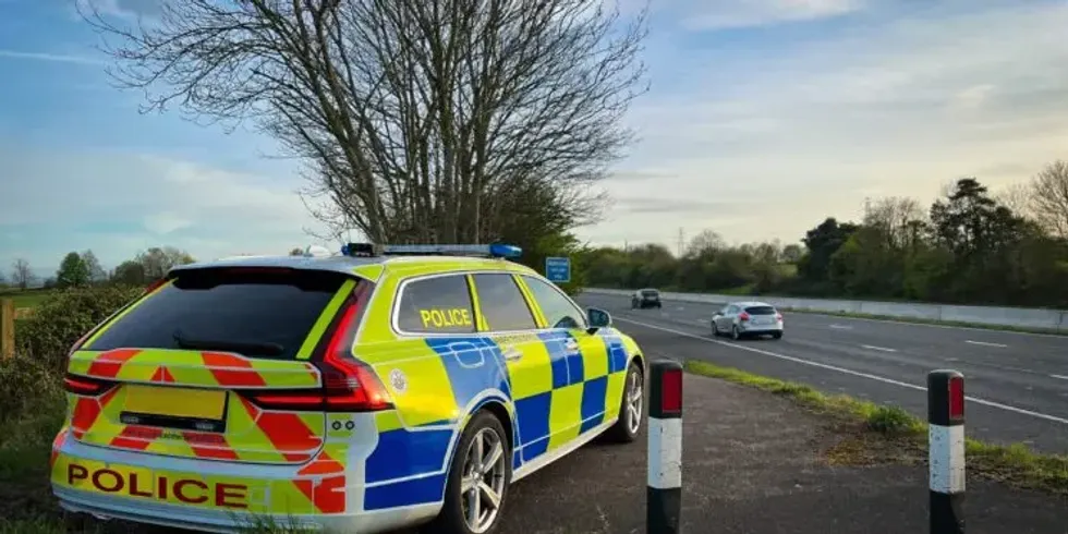 Speed cameras and a police officer pulling a car over