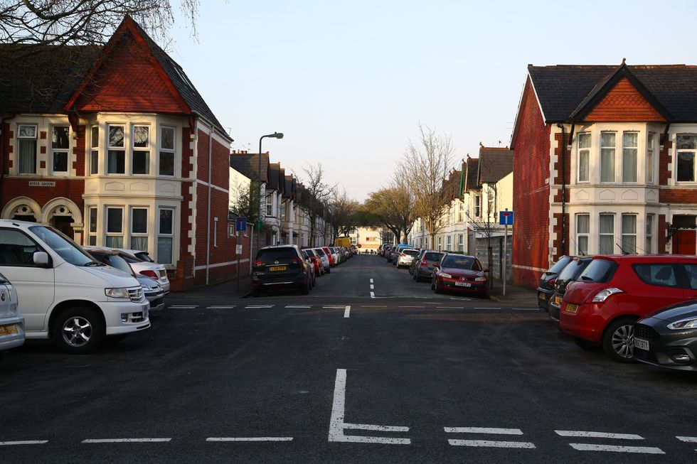 Stock image of cars parked along pavements