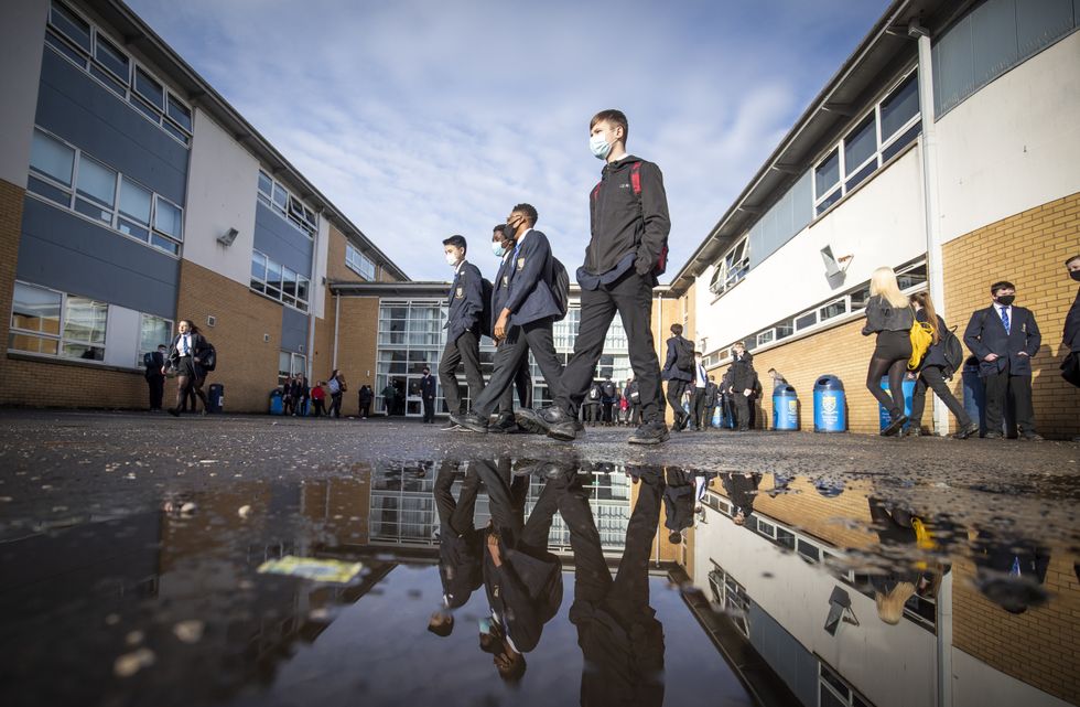 Students arriving at St Andrew's RC Secondary School in Glasgow.