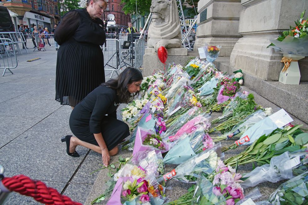 Suella Braverman lays floral tribute