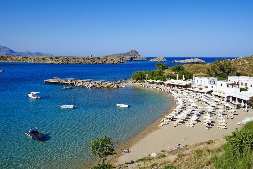 Sunny beach with bright blue sea in Rhodes