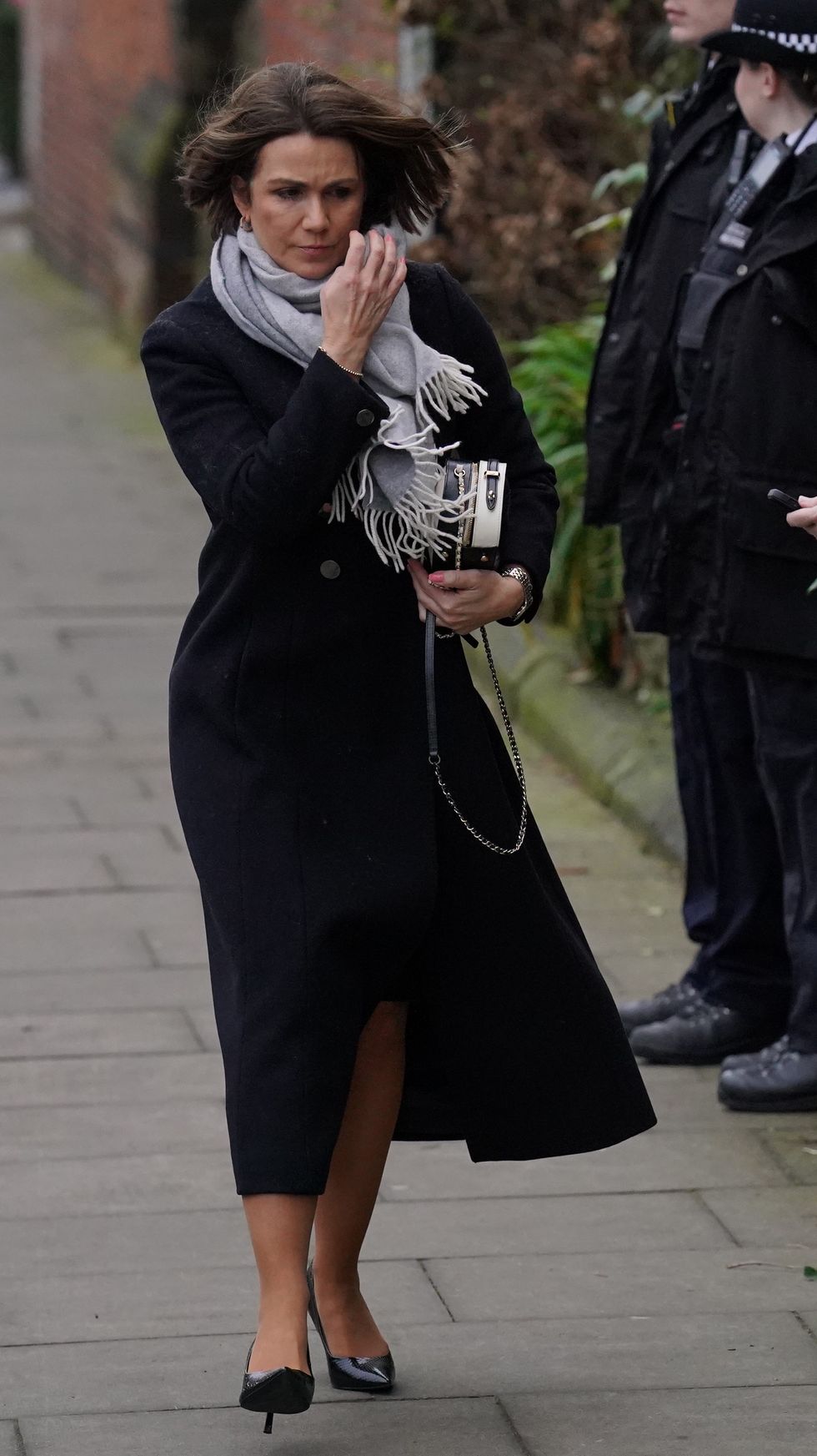 Kate Garraway looks teary-eyed as she arrives for star-studded funeral ...