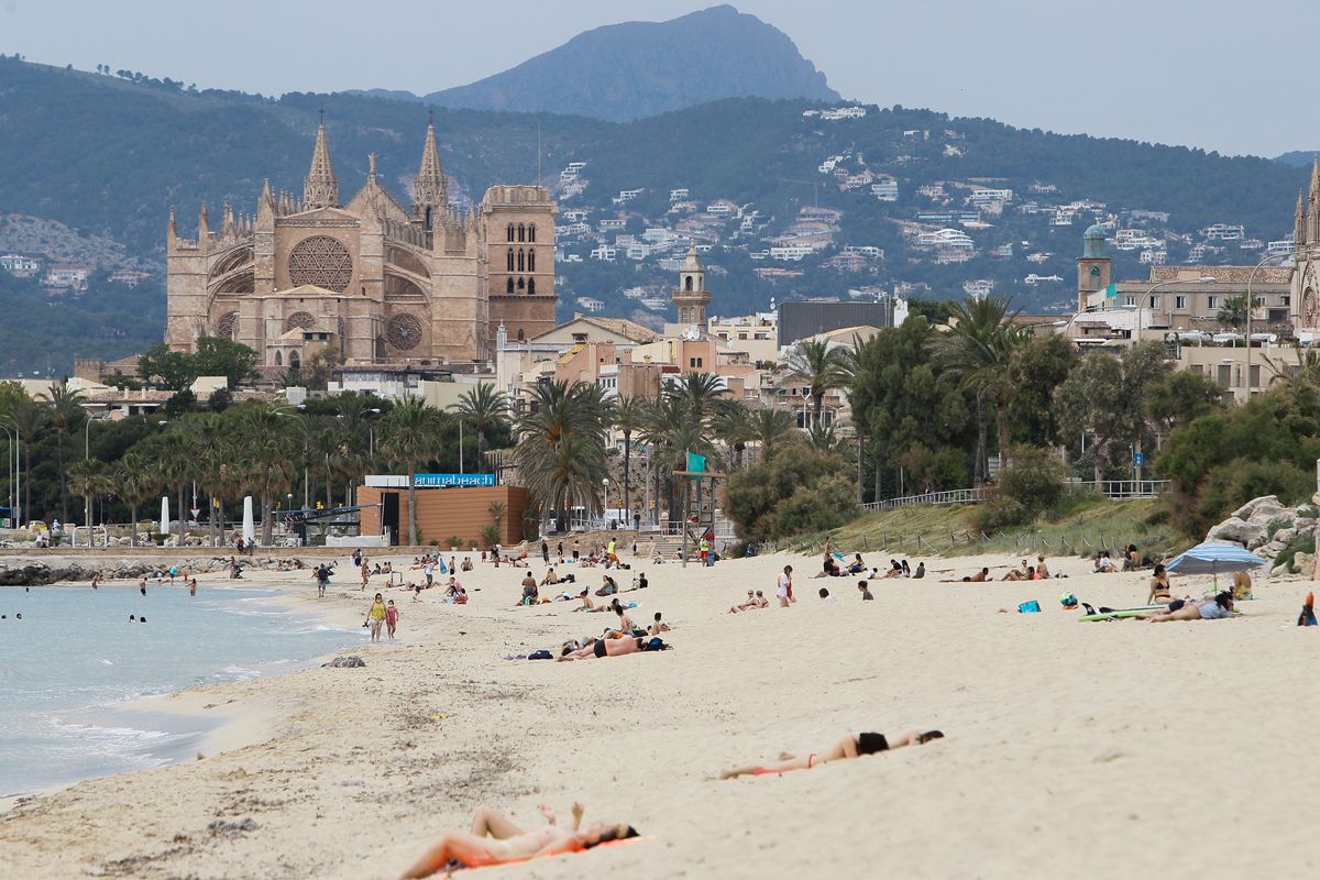  Swimmers on a beach in Palma