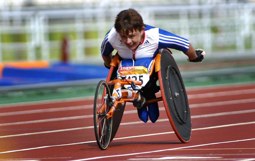 Tanni Grey-Thompson and an electric vehicle charging station