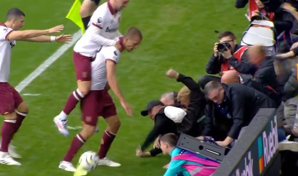 The boy looked in some distress when the hoardings came down on top of him