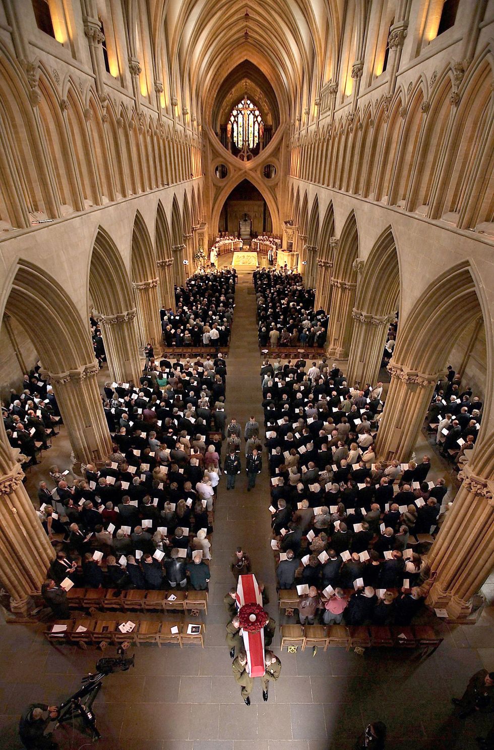 The flag draped coffin of World War I veteran Harry Patch is carried out of Wells Cathedral by soldiers from The Rifles, after the service in Somerset. In 2009