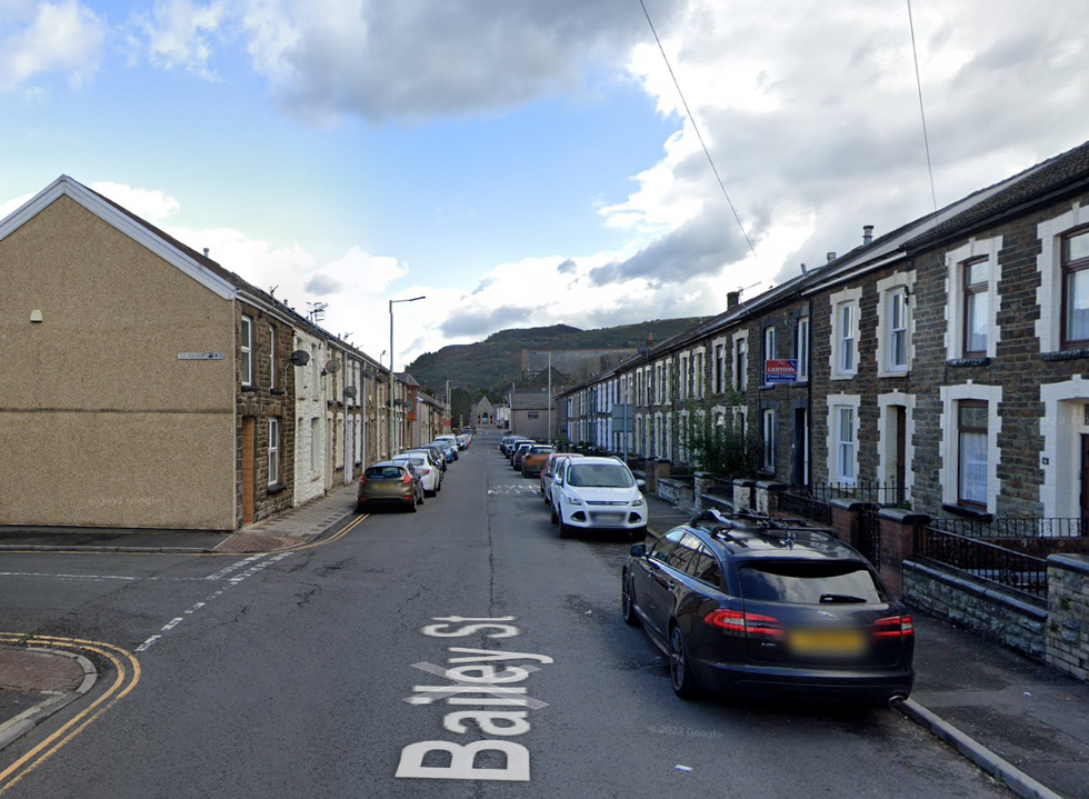 The flag was hoisted up overnight on telephone lines in Bailey Street, Ton Pentre