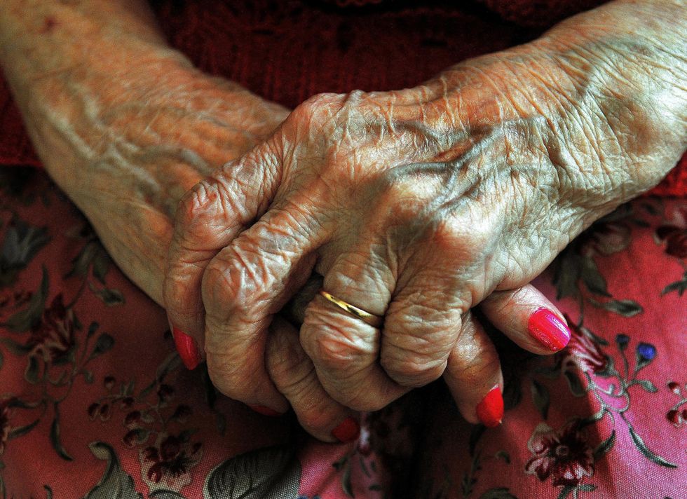 The hands of a resident at a nursing home