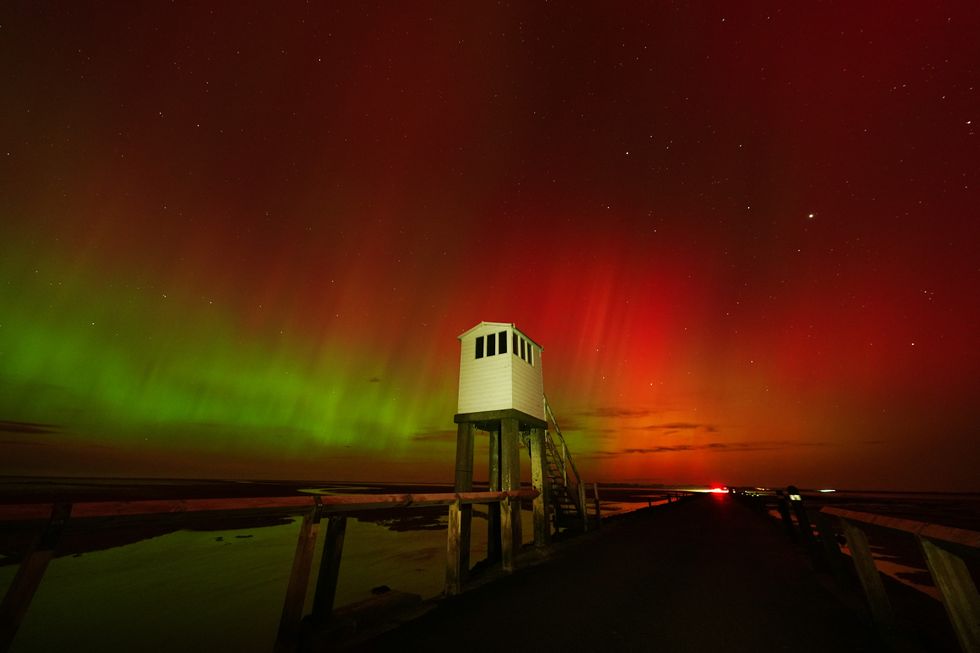 The Northern Lights, also known as the Aurora Borealis, seen in an incredible display in the skies over the refuge hut on the causeway leading to Holy Island in Northumberlandu200b