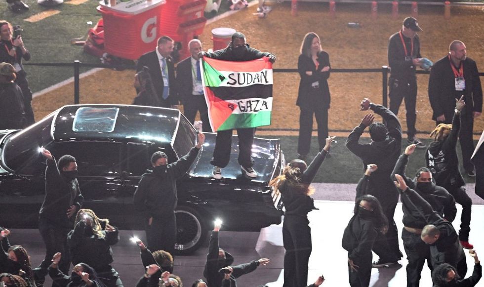 The protester appeared to be a part of the dance group