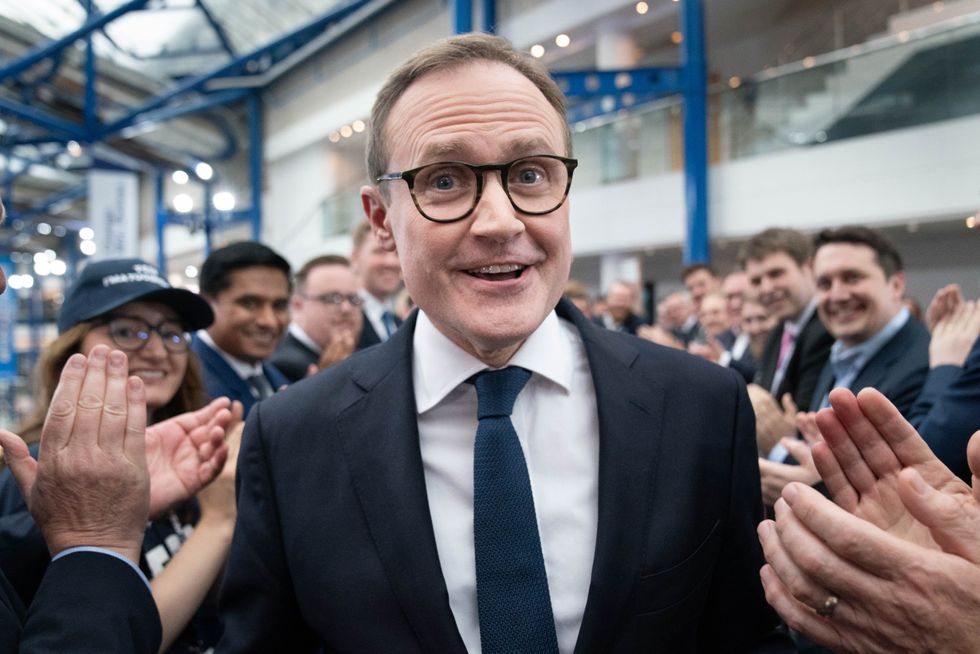 Tory leadership candidate, Tom Tugendhat walks past supporters after attending a hustings event during the Conservative Party Conference at the International Convention Centre in Birmingham