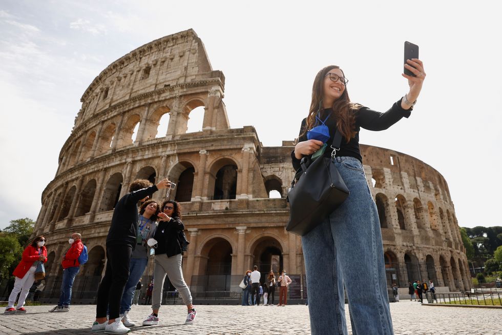 Tourists outside the Colosseum, Rome