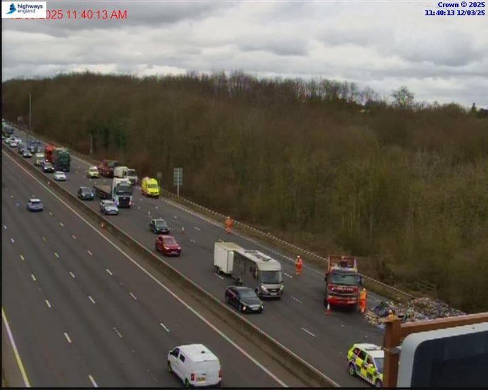 Traffic cameras show emergency services attending the scene on the M1