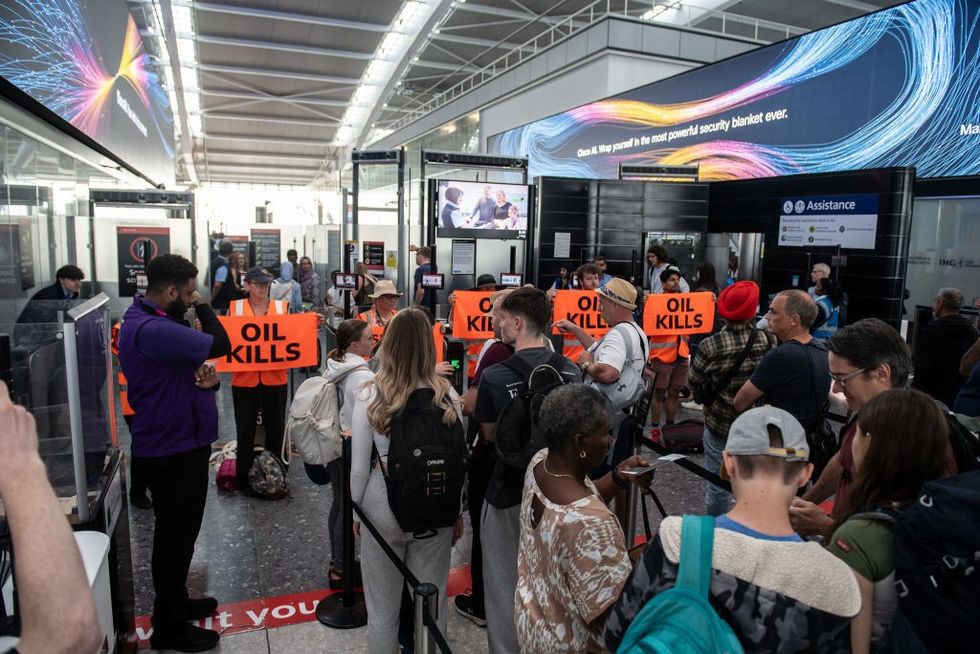 \u200b Just Stop Oil protestors block the departure gates at Heathrow