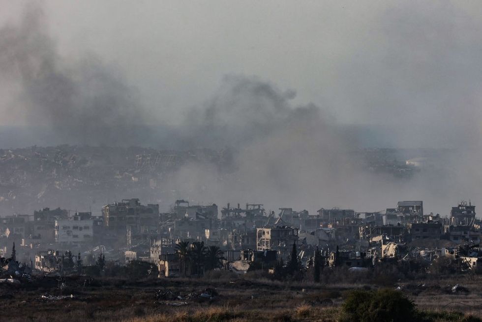 u200b Smoke rising above destroyed buildings in the northern Gaza Strip during Israeli bombardment