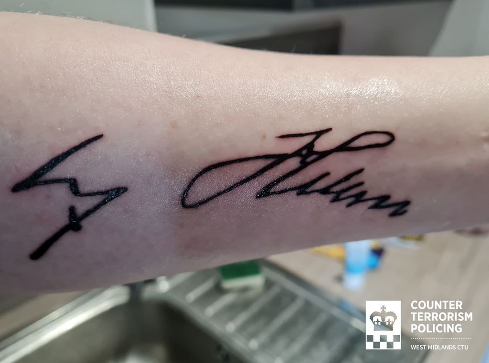 u200b The tattoo of Adolf Hitler's signature on his left forearm of Callum Ulysses Parslow.