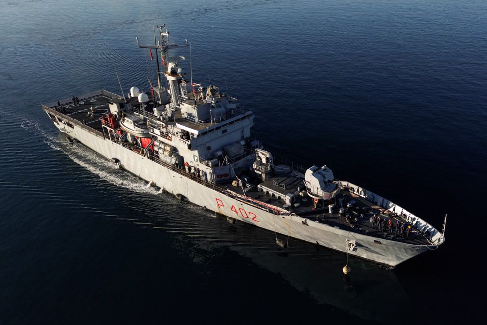 u200bA drone view of Italian navy ship Libra carrying migrants arriving in Albania, as part of a deal with Italy to process thousands of asylum-seekers caught near Italian waters